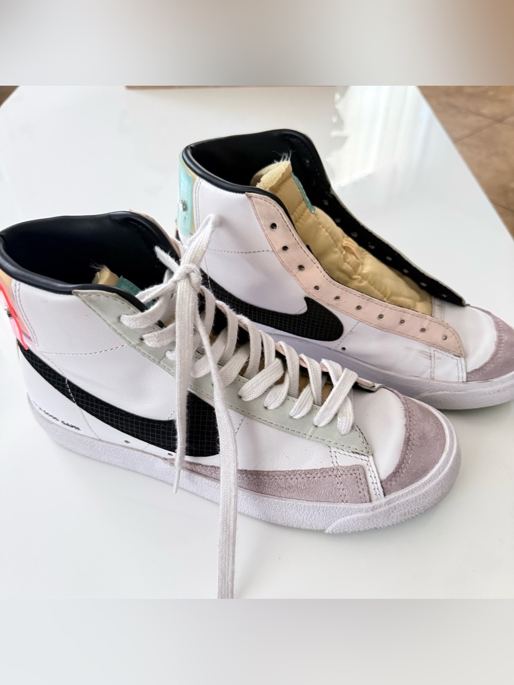Nike Women’s White High-Top Sneakers with Black Swoosh and Pastel Accents